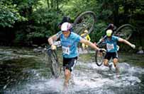 Mountain bikers crossing river, Brecon Beacons